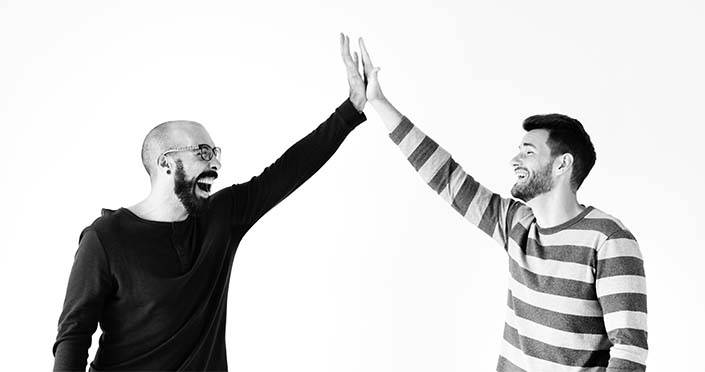 Two men giving a high five 2022 12 16 01 13 57 utc